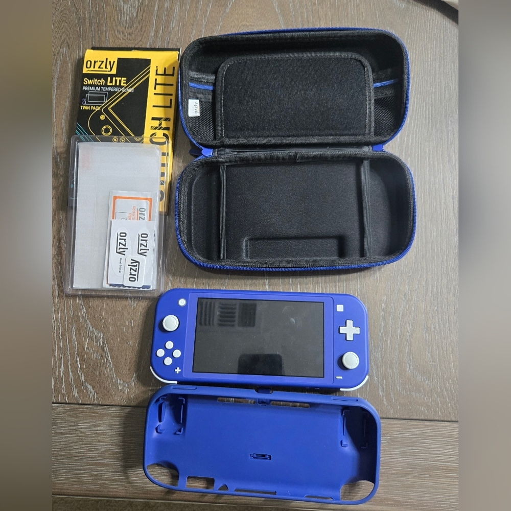 Nintendo Blue Gaming Console, Case, 1 Screen Protector, And Charger - Picture 2 of 3